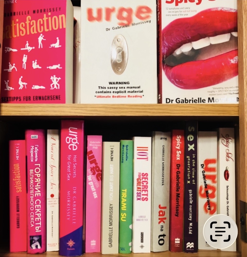 Shelf of Dr Gabrielle Morrissey's books including Urge, Spicy Sex and Satisfaction in international editions